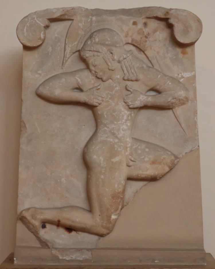 Hoplite race or a pyrrhic dancer relief