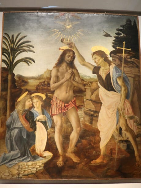 The Baptism of Christ (c. 1470-5) is by Leonardo’s teacher, Andrea del Verrocchio but Da Vinci painted some of it